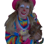 Crazy Daisy the clown in a colorful pink and rainbow costume holding a real rabbit 