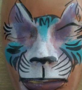 Colorful white and purple and blue kitty face painting design