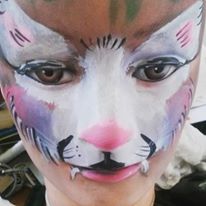 White and purple cat face painting