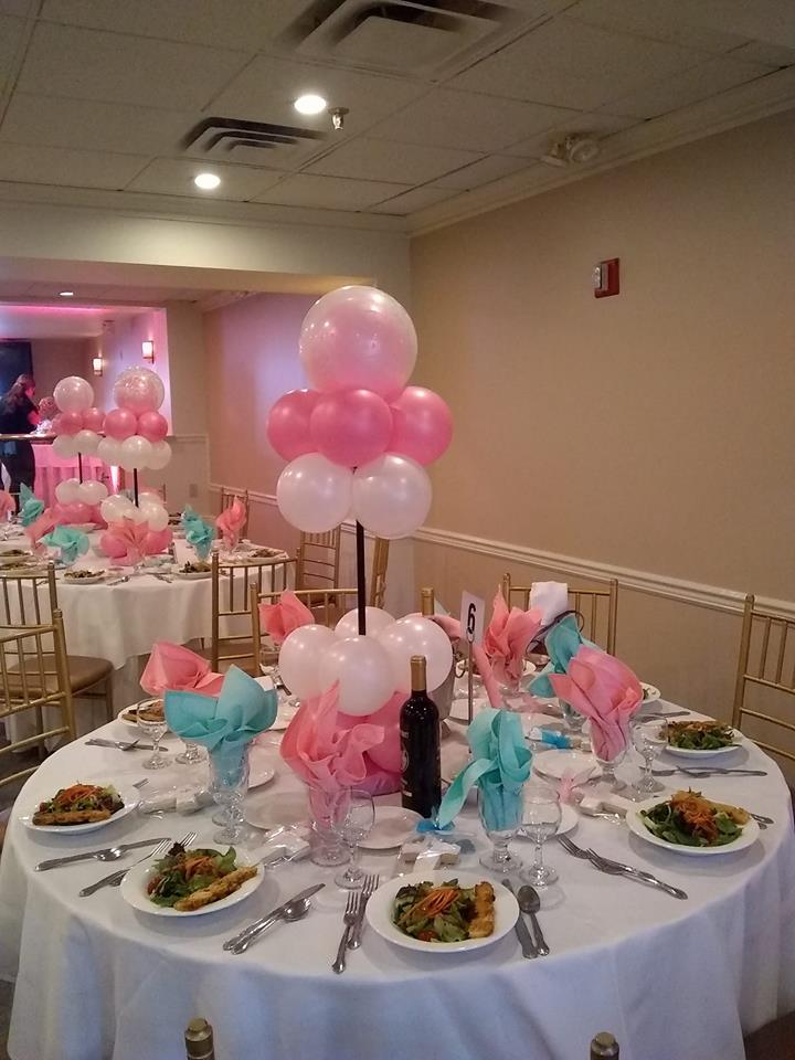 Round pink and white balloon centerpieces for a celebration