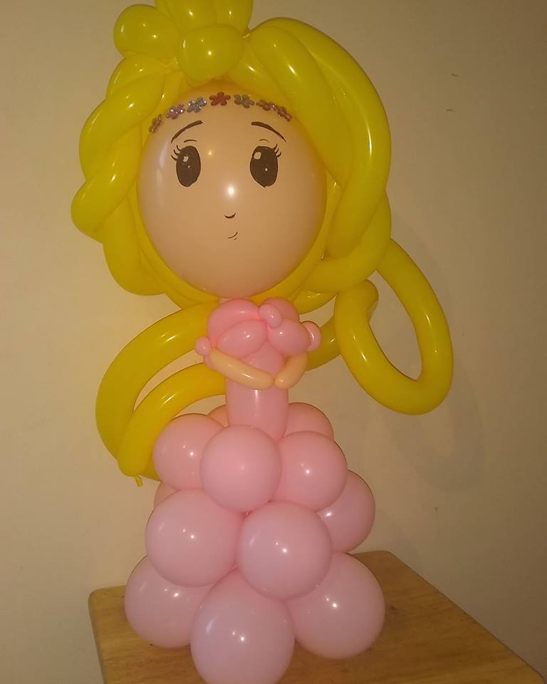 princess balloon centerpiece with yellow hair and a pink dress