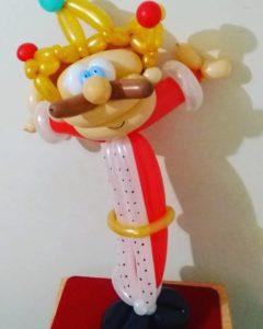 balloon king with blue eyes and a mustache twisted out of balloons for holidays and parties