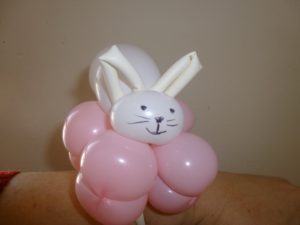 Cute white rabbit balloon on a pink flower balloon bracelet for events 