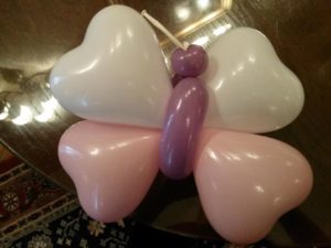 Butterfly balloon made out of pink and white heart balloons for events