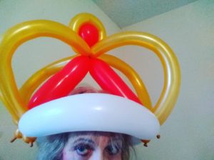 King';s crown made out of red and white and gold balloons twisted for an event 