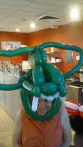 Twisted green balloon dragon mask