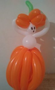 Ghost popping out of a pumpkin balloon twisted for a Halloween party