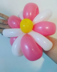 Twisted pink and white balloon bracelet for a party