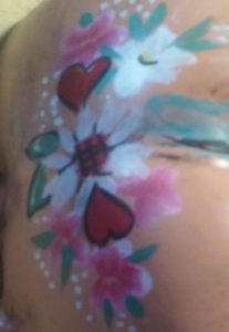Hearts and flowers face painting design
