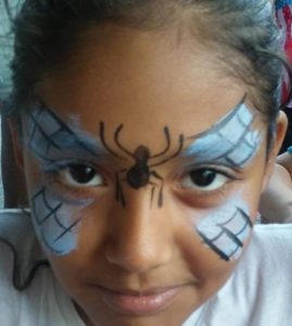 Light blue spider butterfly face painting design for an event