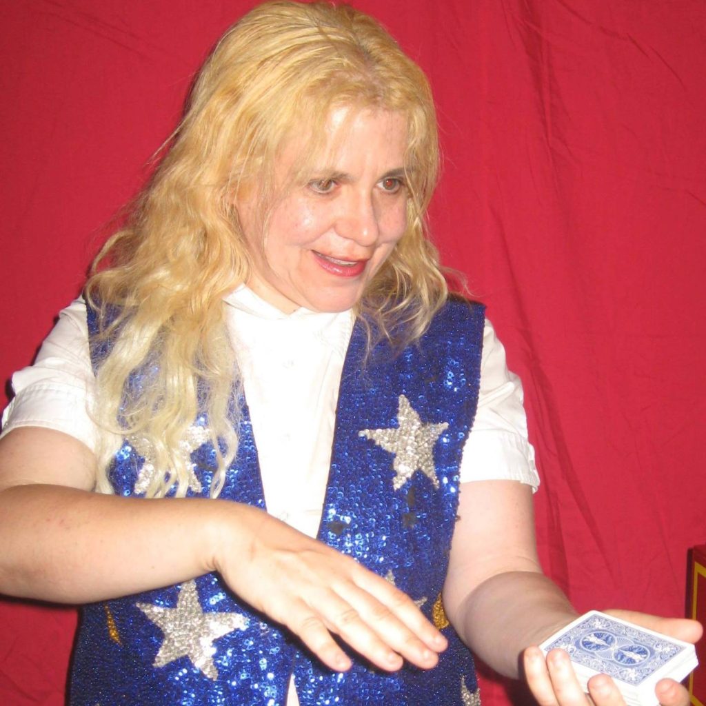 Wendy the magician holding a deck of cards 