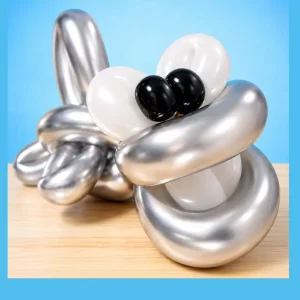 Silver balloon shark sculpture by a Long Island balloon twister.